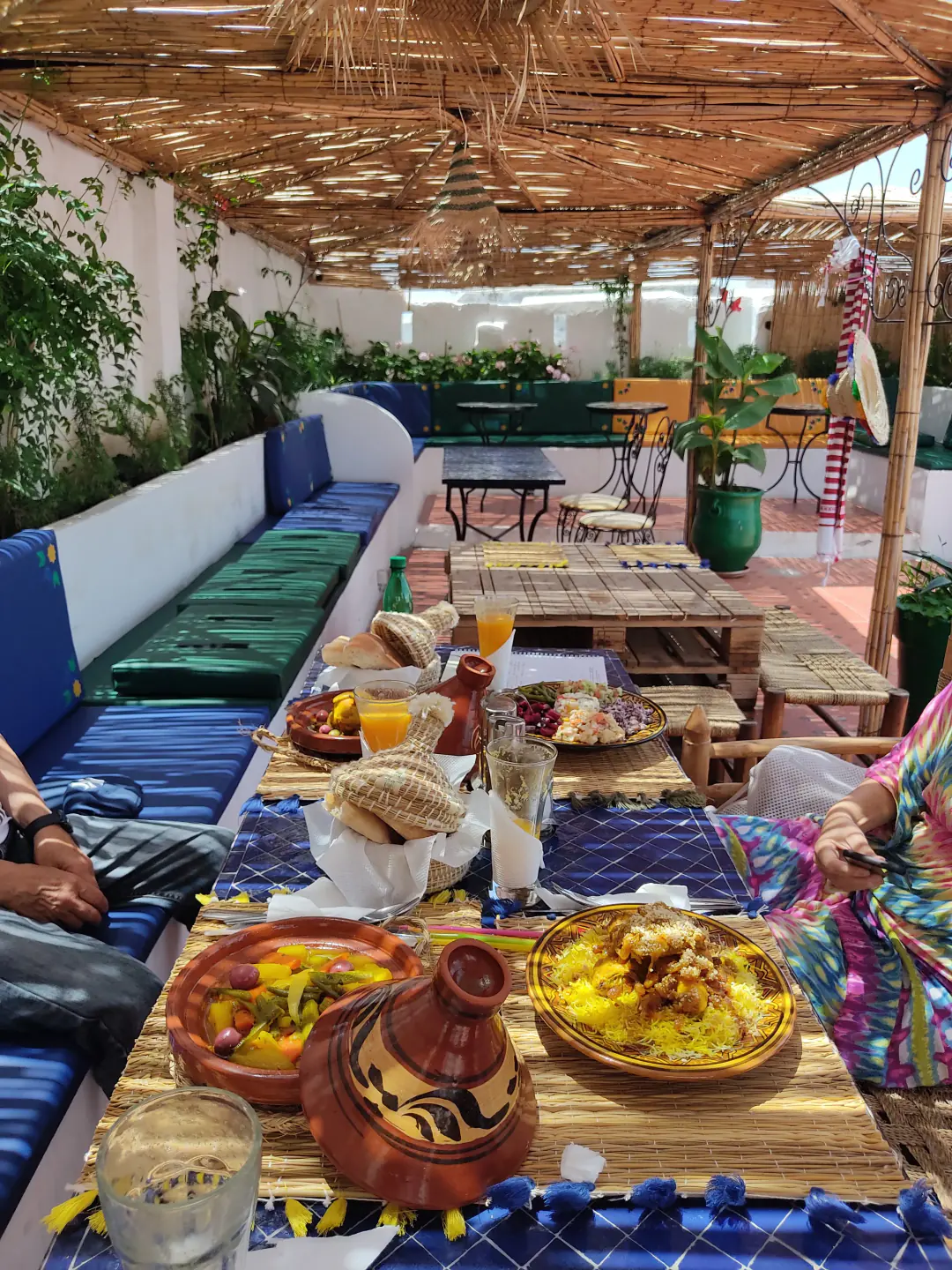 Moroccan dishes shared on the rooftop terrace at Dar La Medina Tetawen