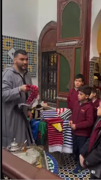 Students discovering Moroccan craft and tea traditions during a school visit